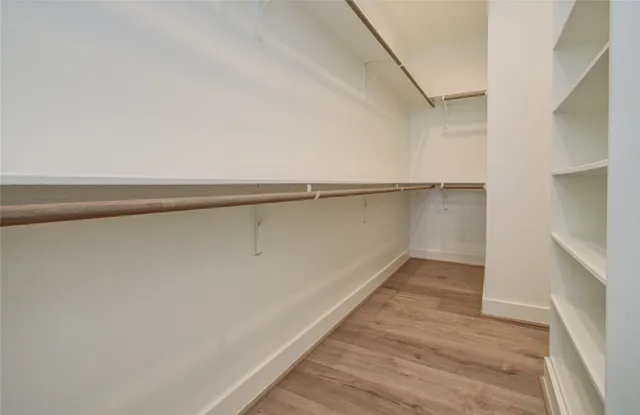 a view of an empty walk in closet