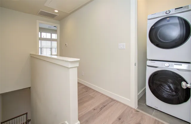 a view of a bedroom with washer and dryer
