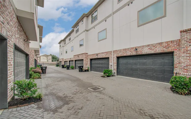 a front view of a building with a yard