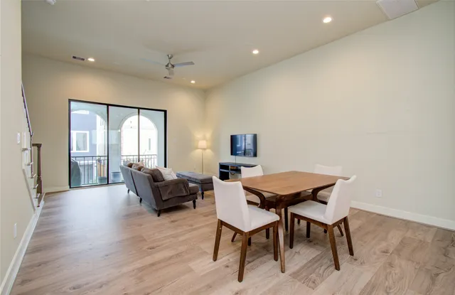a view of a livingroom with furniture and wooden floor