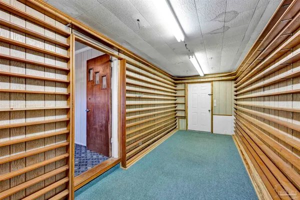 a view of a room with stairs and a window