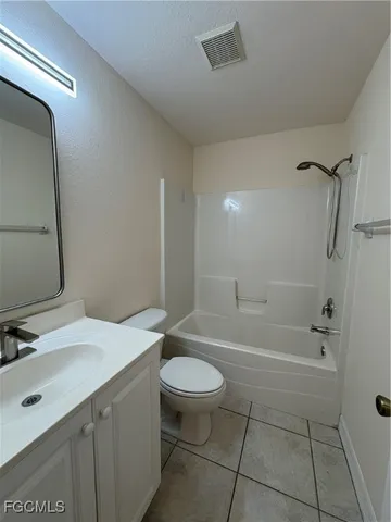 a view of room with stairs and white walls