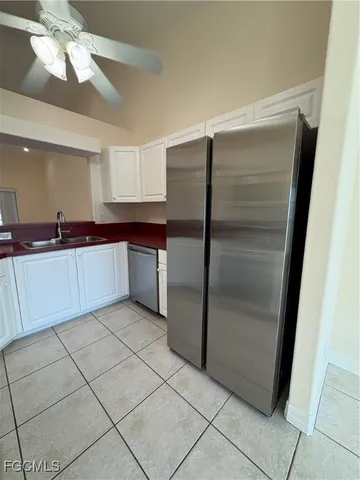 a kitchen with a sink a stove and cabinets