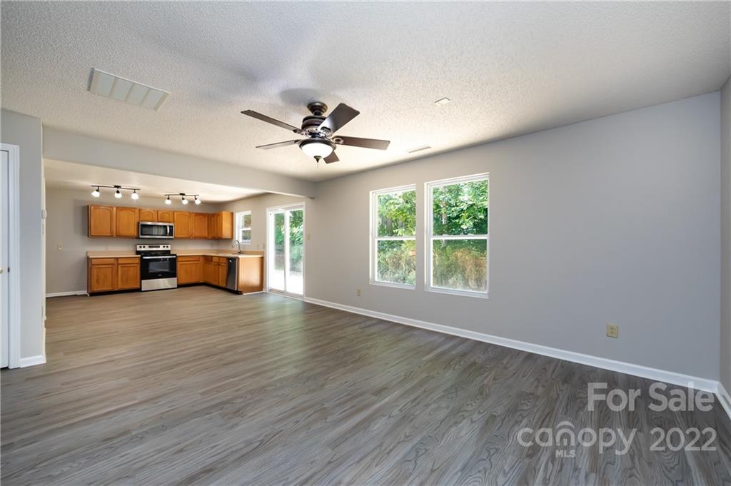 776 Ladino Lane Clover, SC 29710 - Photo 11 of 44 a view of an empty room with a window and wooden floor
