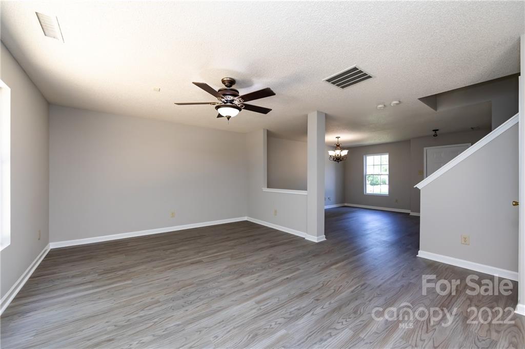 776 Ladino Lane Clover, SC 29710 - Photo 13 of 44 a view of an empty room with wooden floor and a window