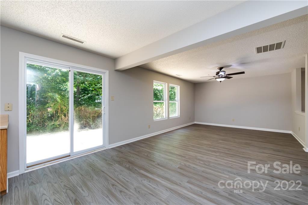 776 Ladino Lane Clover, SC 29710 - Photo 16 of 44 a view of empty room with wooden floor and fan