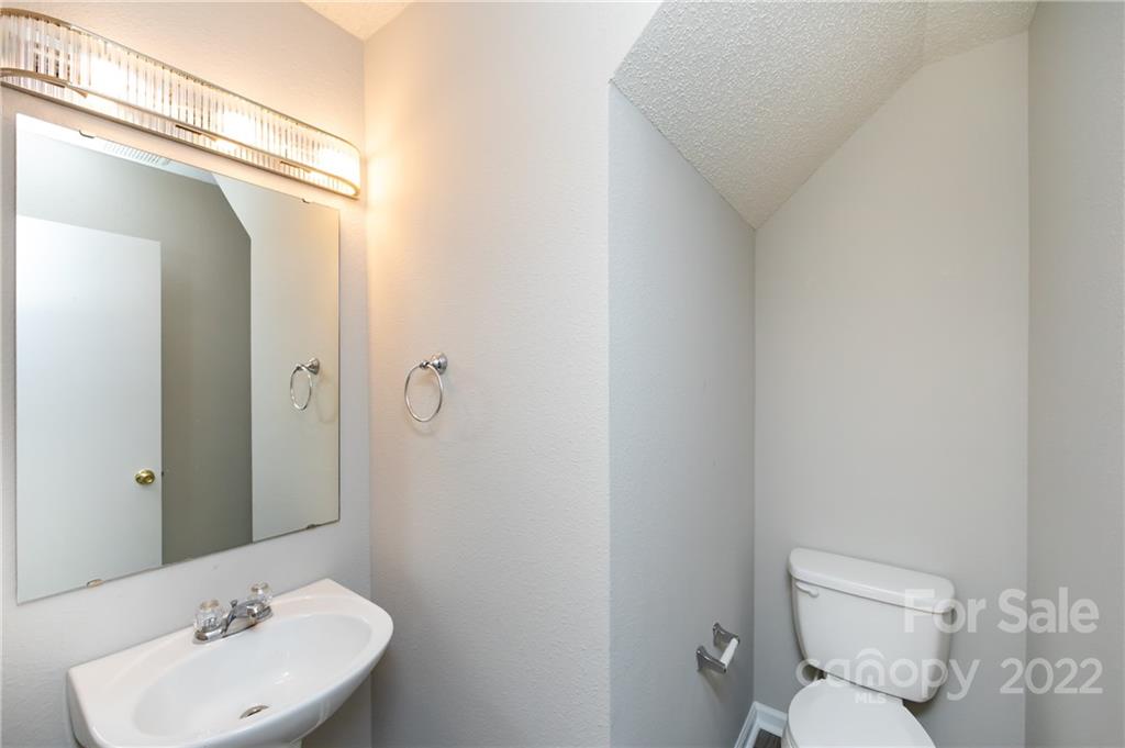 776 Ladino Lane Clover, SC 29710 - Photo 24 of 44 a bathroom with a toilet a sink and mirror