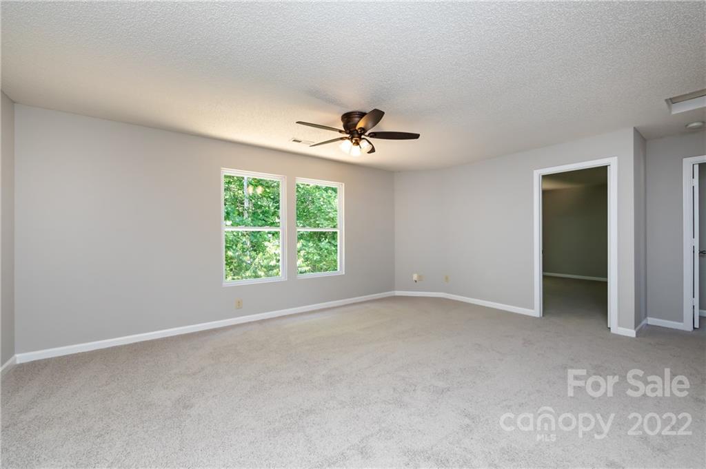 776 Ladino Lane Clover, SC 29710 - Photo 27 of 44 an empty room with a ceiling fan and window
