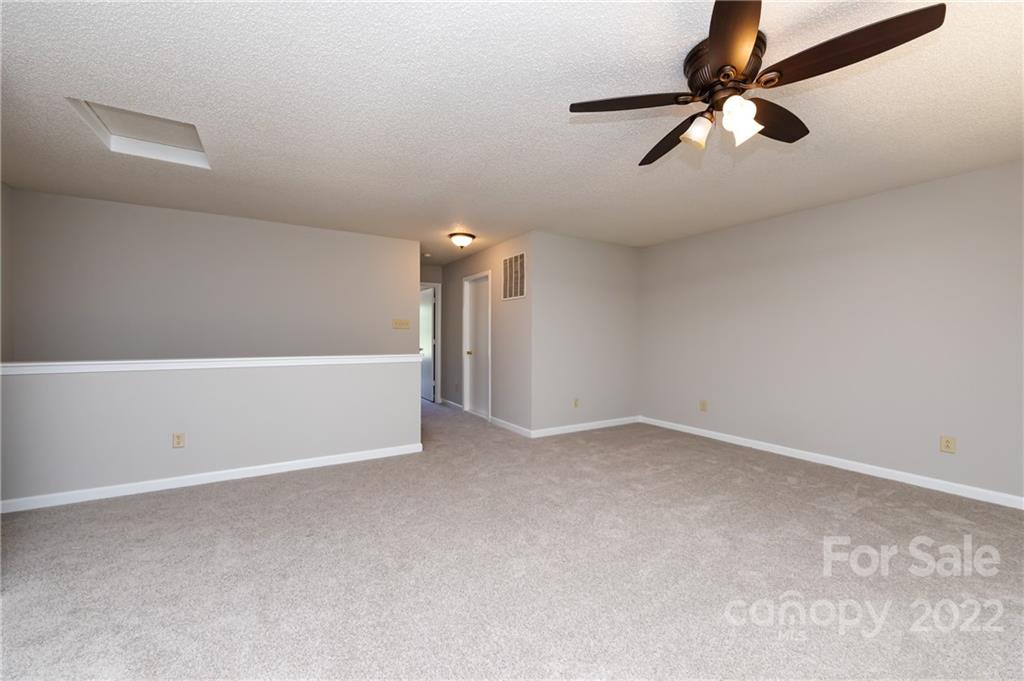 776 Ladino Lane Clover, SC 29710 - Photo 29 of 44 an empty room with a ceiling fan and window