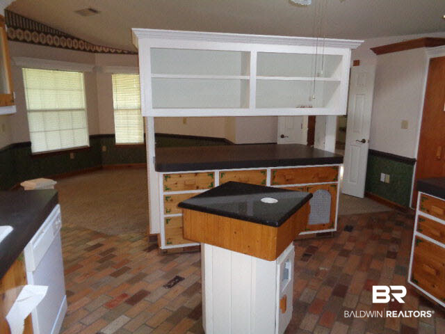 28202 Vargo Lane Elberta, AL 36530 - Photo 8 of 45 Open shelving. Center island is cabinet for garbage can.