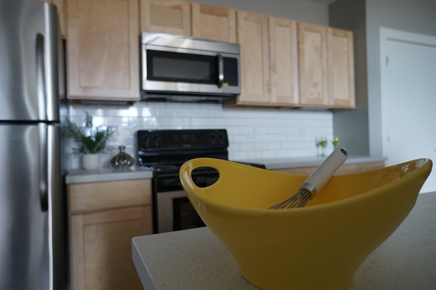 135 West Wells Street Milwaukee, WI 53203 - Photo 11 of 13 a kitchen with stainless steel appliances granite countertop a refrigerator a stove top oven a sink and dishwasher