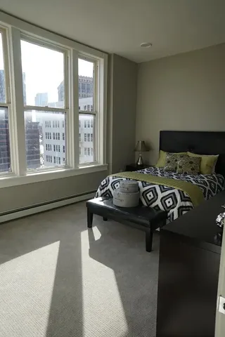 a room with a bed and a window