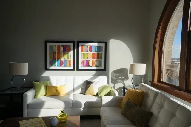 a living room with furniture and a large window