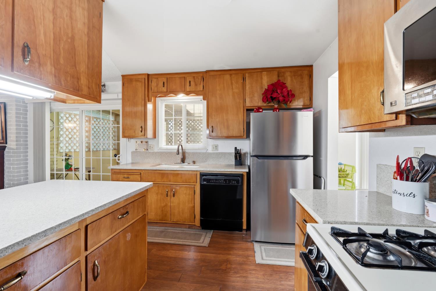 3356 Ocotillo Way Modesto, CA 95355 - Photo 13 of 33 a kitchen with a sink stove and refrigerator