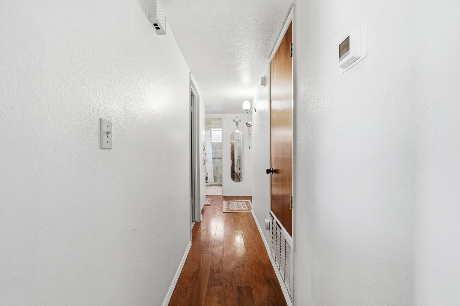 3356 Ocotillo Way Modesto, CA 95355 - Photo 15 of 33 a view of hallway with wooden floor