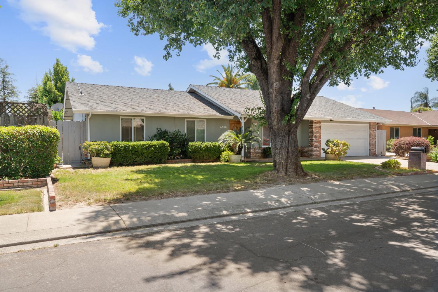 3356 Ocotillo Way Modesto, CA 95355 - Photo 2 of 33 a front view of a house with garden