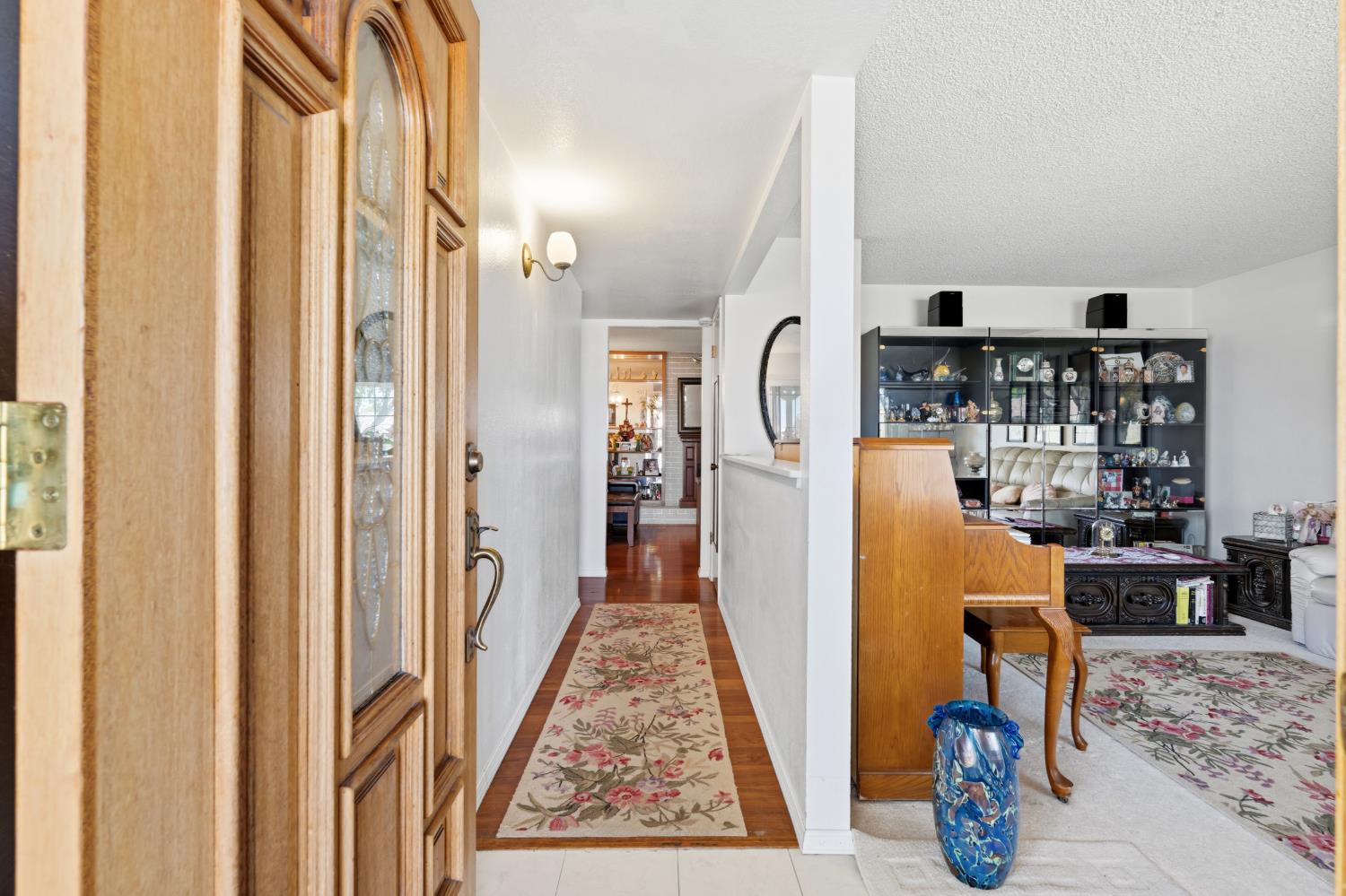 3356 Ocotillo Way Modesto, CA 95355 - Photo 6 of 33 a view of a hallway with wooden floor and furniture