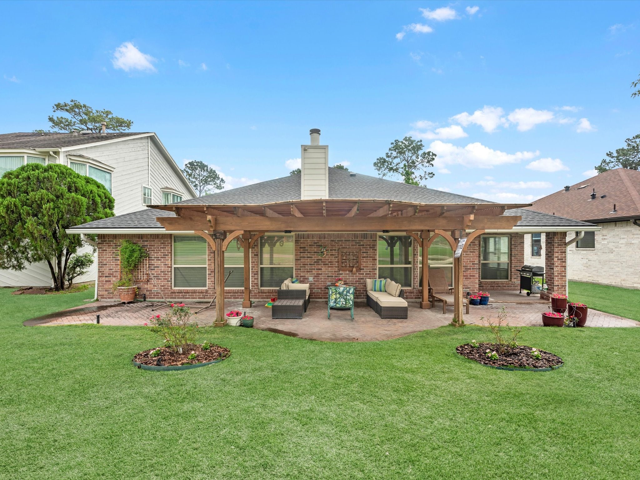19019 Relay Road Humble, TX 77346 - Photo 28 of 31 a front view of a house with garden and outdoor seating