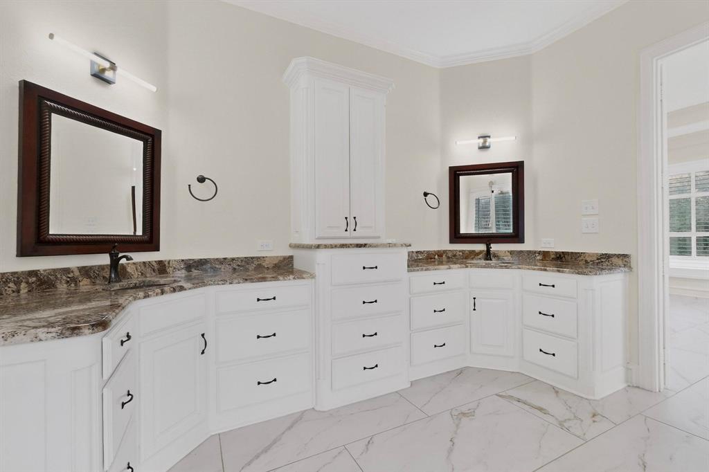531 East Hickory Ridge Circle Argyle, TX 76226 - Photo 18 of 37 a bathroom with a granite countertop sink and a mirror