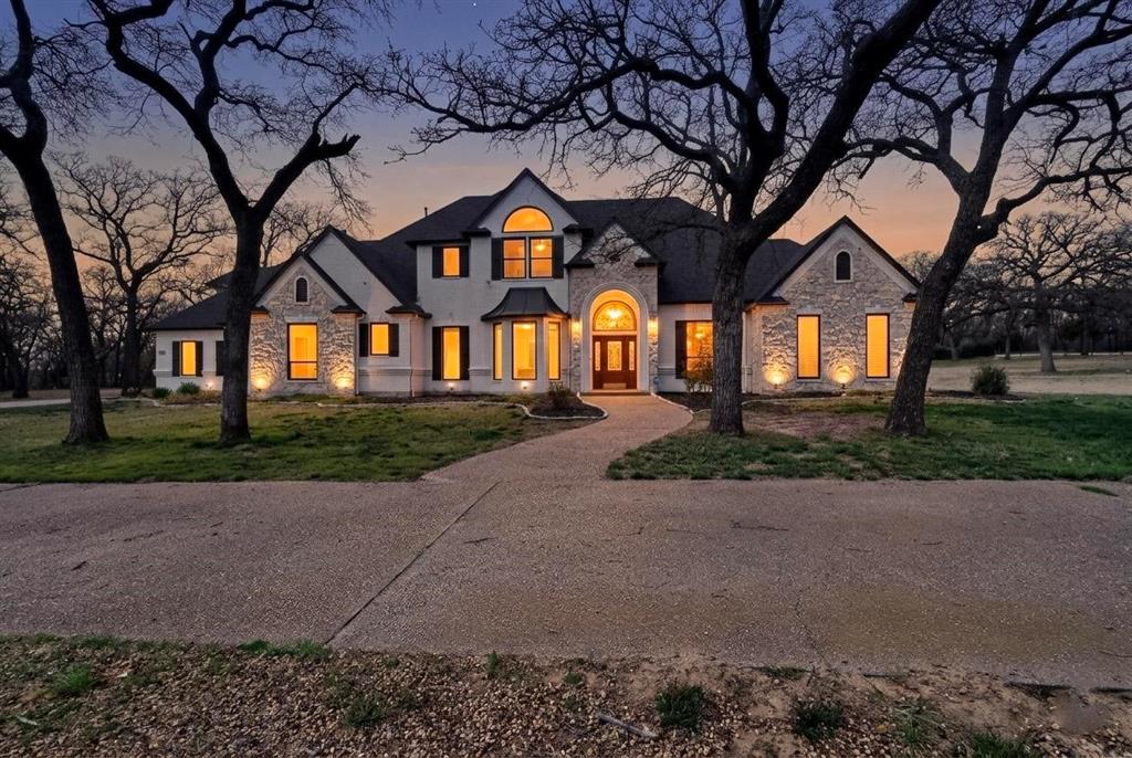 531 East Hickory Ridge Circle Argyle, TX 76226 - Photo 2 of 37 a front view of house with yard and green space