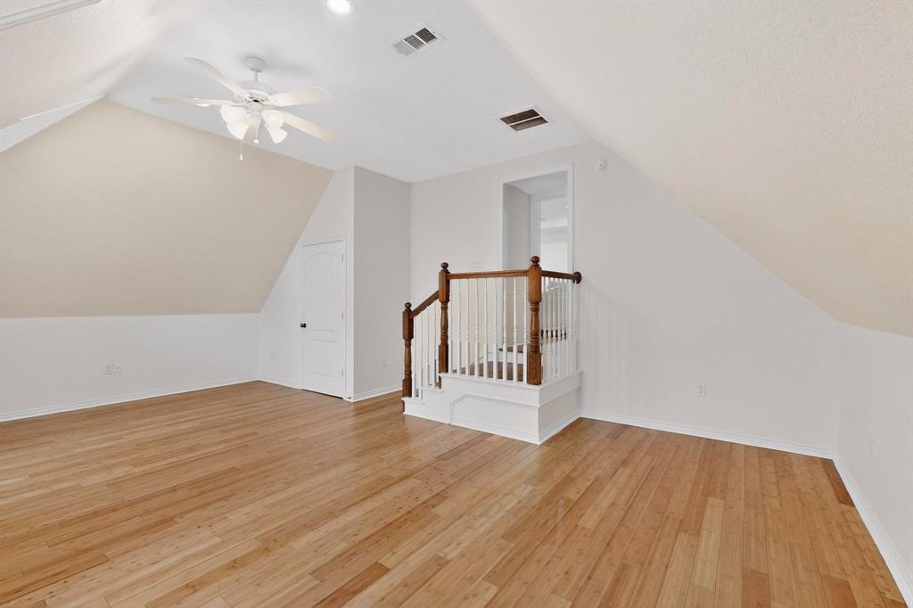 531 East Hickory Ridge Circle Argyle, TX 76226 - Photo 22 of 37 a view of an empty room with wooden floor
