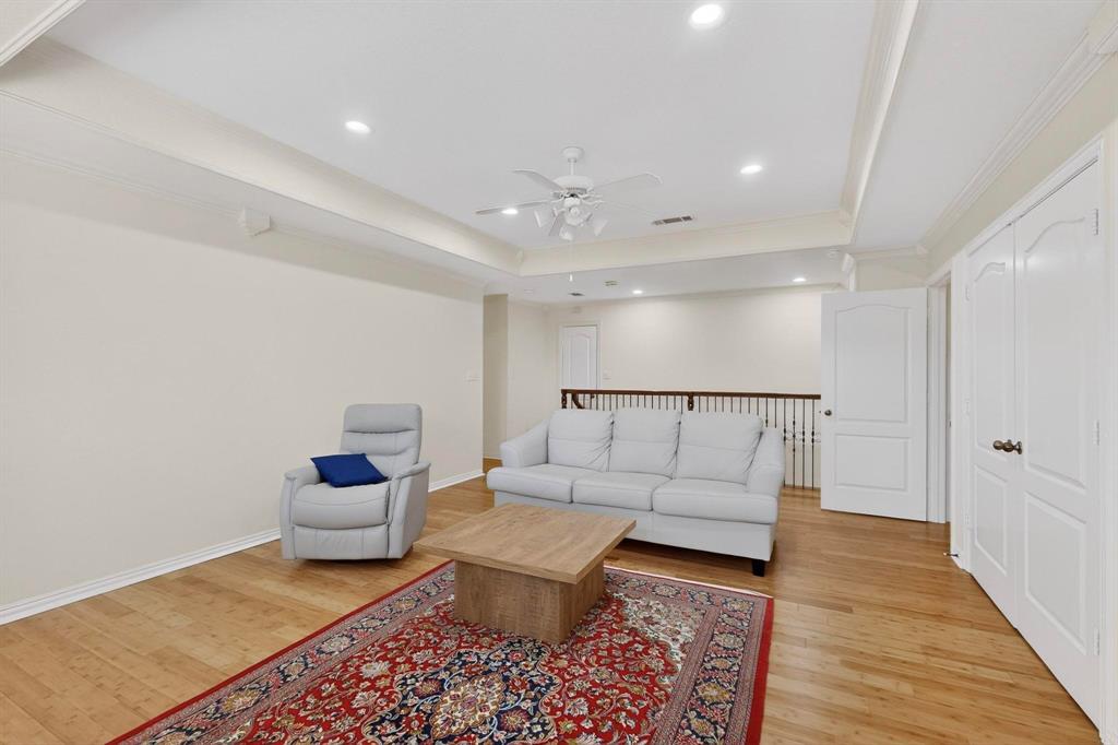 531 East Hickory Ridge Circle Argyle, TX 76226 - Photo 25 of 37 a living room with furniture and a rug