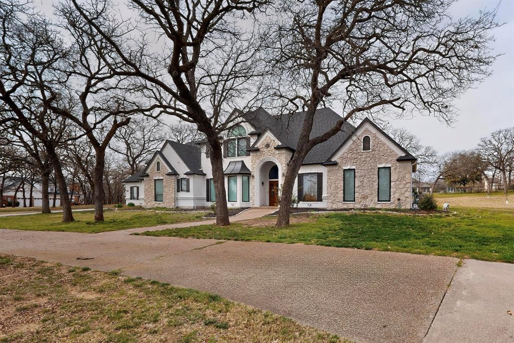 531 East Hickory Ridge Circle Argyle, TX 76226 - Photo 3 of 37 a front view of a house with a yard