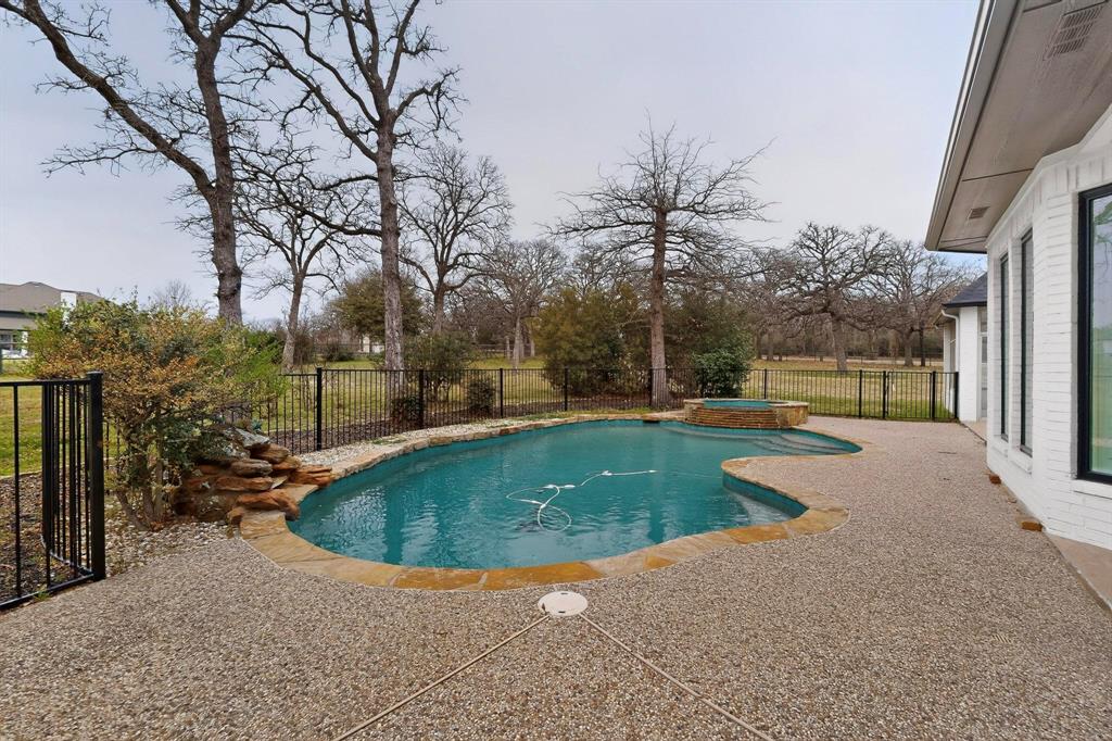 531 East Hickory Ridge Circle Argyle, TX 76226 - Photo 33 of 37 a view of a swimming pool with a patio