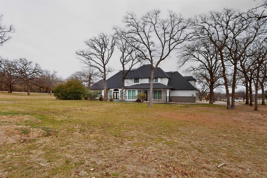 531 East Hickory Ridge Circle Argyle, TX 76226 - Photo 35 of 37 a front view of a house with a yard