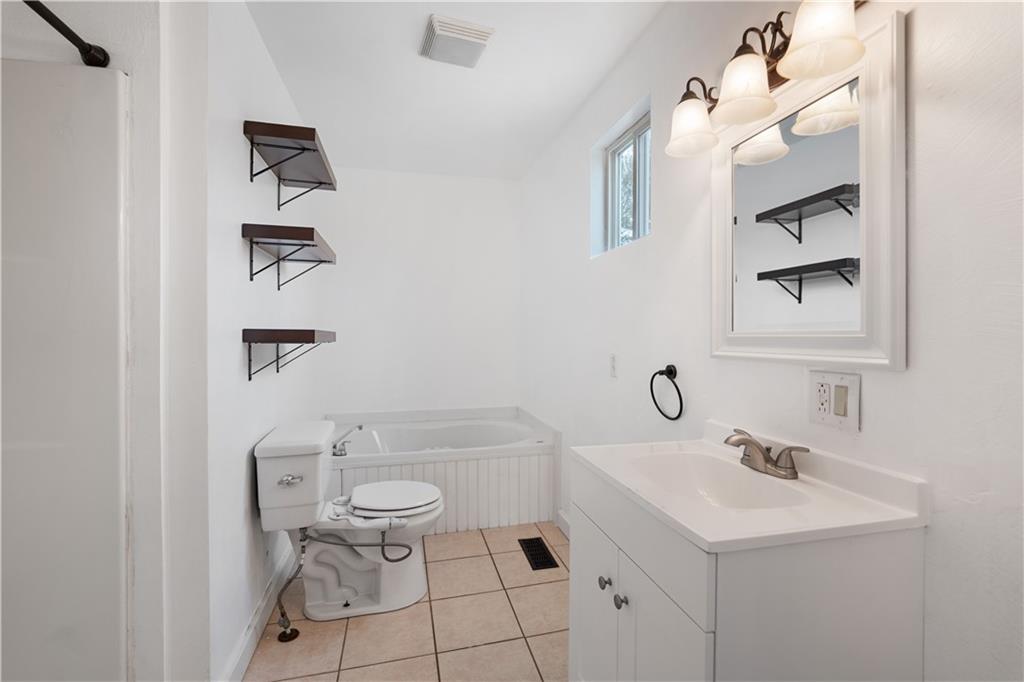 607 Fayette City Road Perryopolis, PA 15473 - Photo 13 of 31 a bathroom with a sink toilet and shower