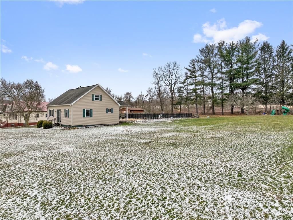 607 Fayette City Road Perryopolis, PA 15473 - Photo 26 of 31 a front view of a house with garden
