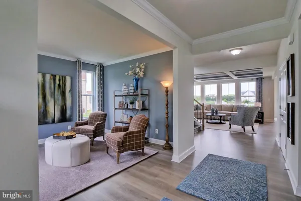 a view of a livingroom with furniture and a flat screen tv