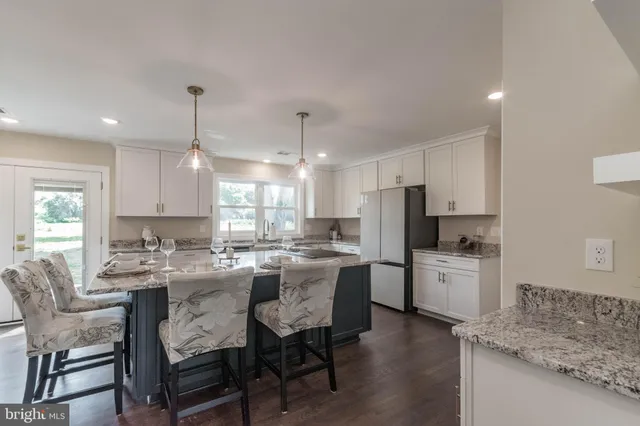 a view of yard with swimming pool and green space