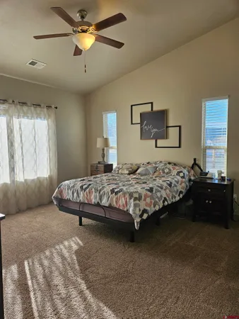 a bedroom with a bed and furniture