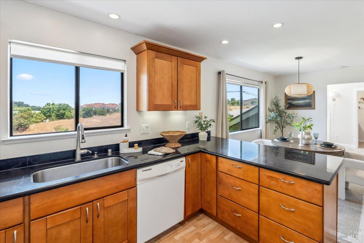 106 Posada Del Sol Novato, CA 94949 - Photo 13 of 27 a kitchen with granite countertop stainless steel appliances a sink window and cabinets