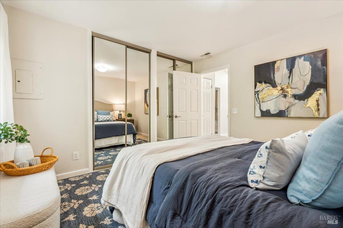 106 Posada Del Sol Novato, CA 94949 - Photo 17 of 27 a bedroom with a bed and a couch