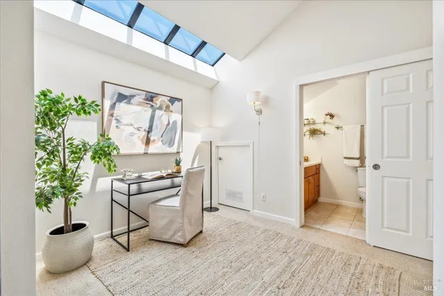 a view of a livingroom with furniture and a potted plant