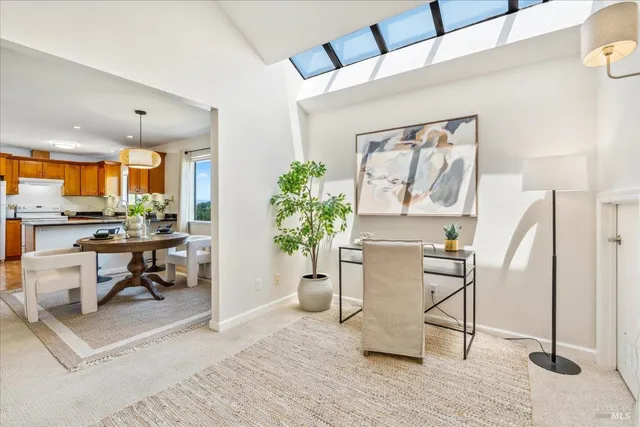 a living room with furniture and a table