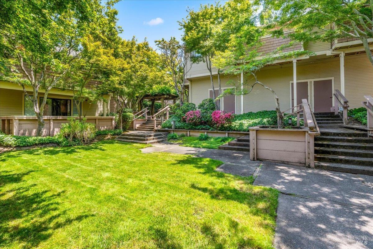 106 Posada Del Sol Novato, CA 94949 - Photo 27 of 27 a front view of a house with a yard garage and outdoor seating