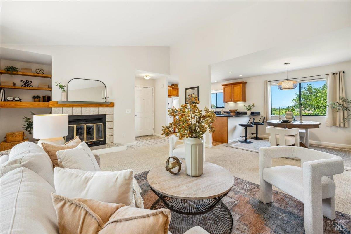 106 Posada Del Sol Novato, CA 94949 - Photo 3 of 27 a living room with furniture fireplace and a large window