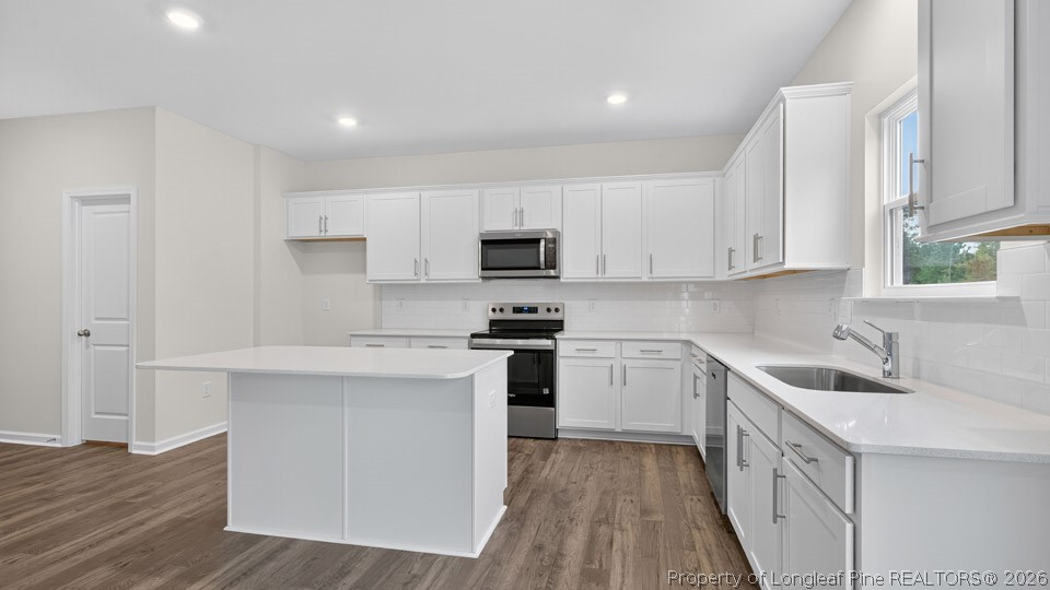 152 Charlies Bnd Way Spring Lake, NC 28390 - Photo 11 of 34 a kitchen with white cabinets sink and stainless steel appliances
