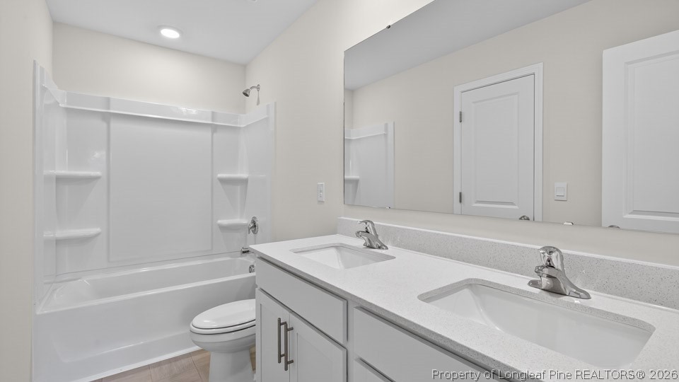 152 Charlies Bnd Way Spring Lake, NC 28390 - Photo 27 of 34 a bathroom with a sink double vanity granite toilet tub and shower