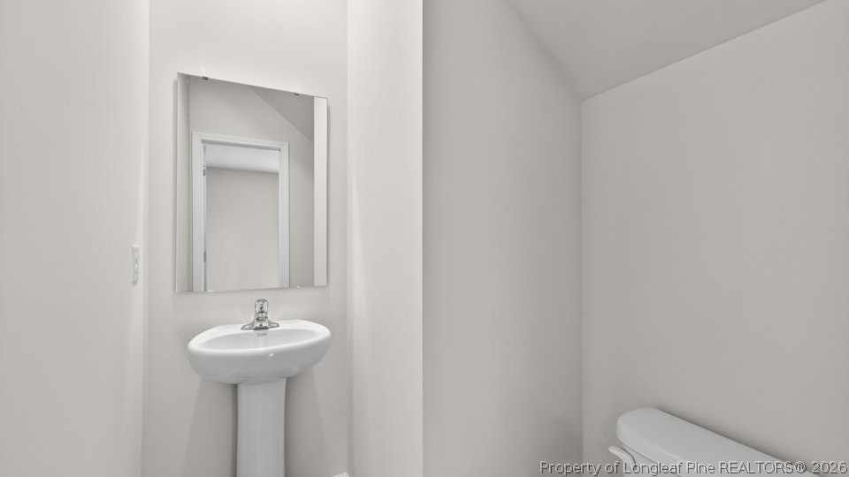 152 Charlies Bnd Way Spring Lake, NC 28390 - Photo 29 of 34 a bathroom with a sink toilet