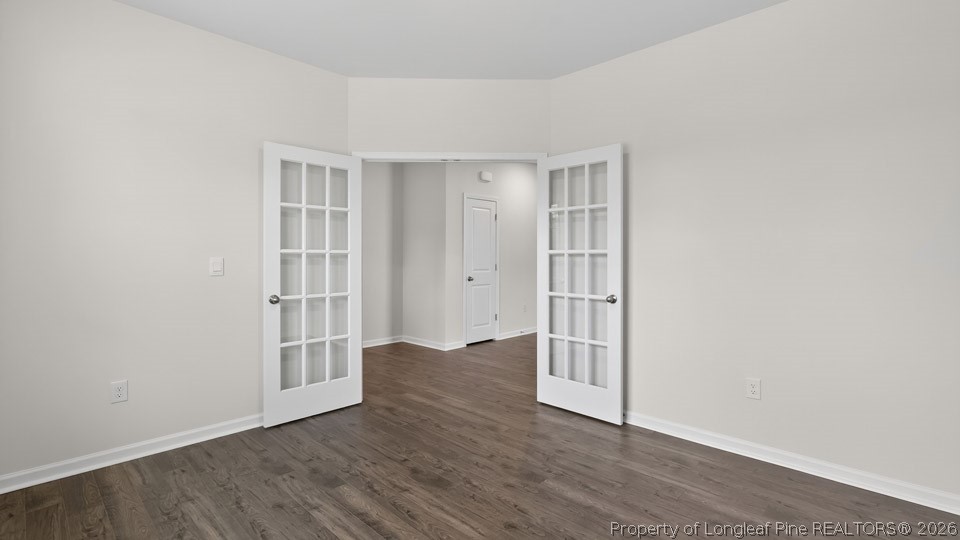 152 Charlies Bnd Way Spring Lake, NC 28390 - Photo 3 of 34 an empty room with wooden floor and windows