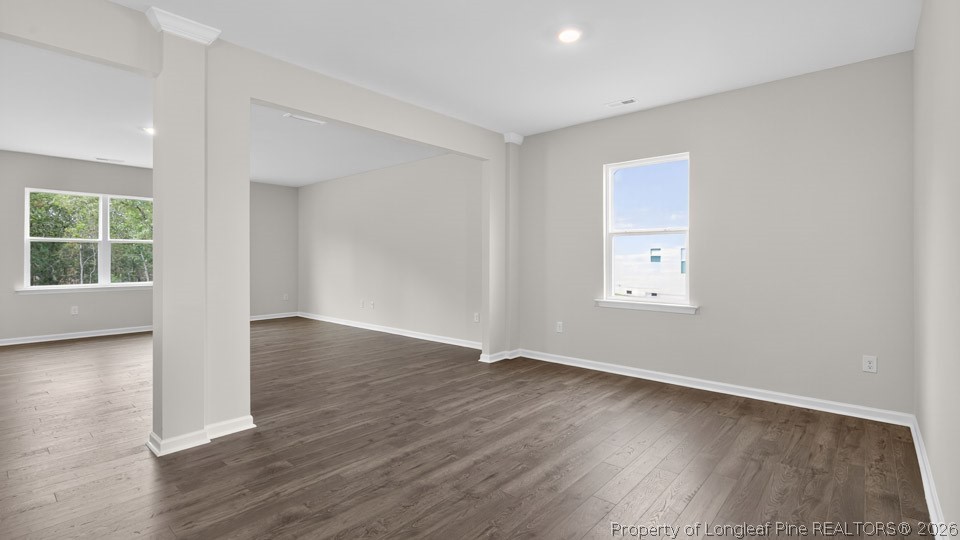 152 Charlies Bnd Way Spring Lake, NC 28390 - Photo 5 of 34 an empty room with wooden floor and windows