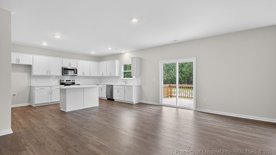 152 Charlies Bnd Way Spring Lake, NC 28390 - Photo 10 of 34 a kitchen with white cabinets and window