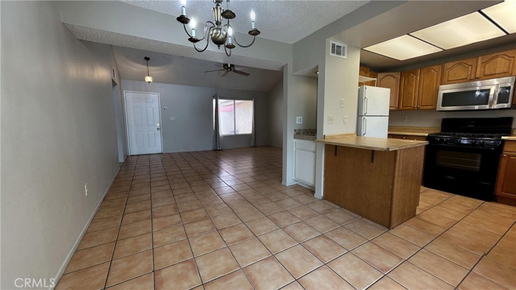 49409 Eisenhower Drive Indio, CA 92201 - Photo 11 of 30 a view of a kitchen with a sink and cabinets