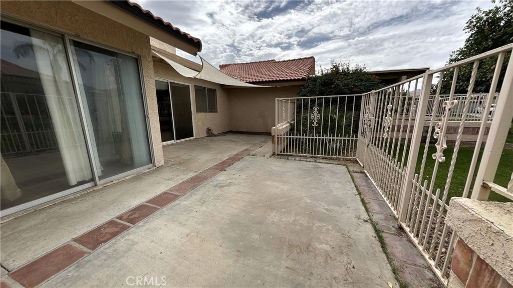 49409 Eisenhower Drive Indio, CA 92201 - Photo 13 of 30 a view of backyard with small cabin and wooden fence