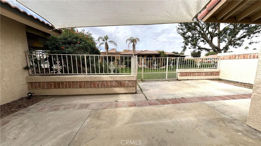 49409 Eisenhower Drive Indio, CA 92201 - Photo 15 of 30 a view of a deck with a floor and fence