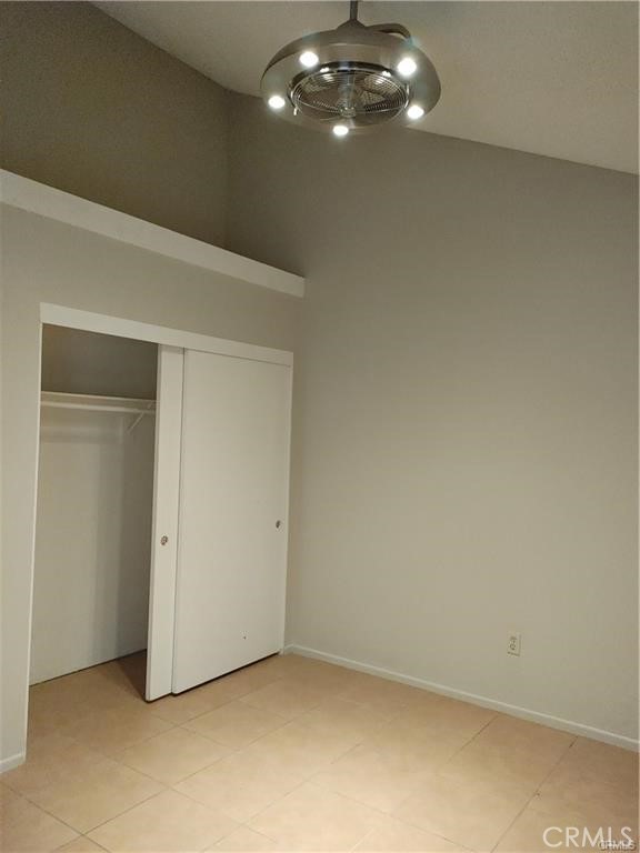 49409 Eisenhower Drive Indio, CA 92201 - Photo 19 of 30 an empty room with a chandelier fan